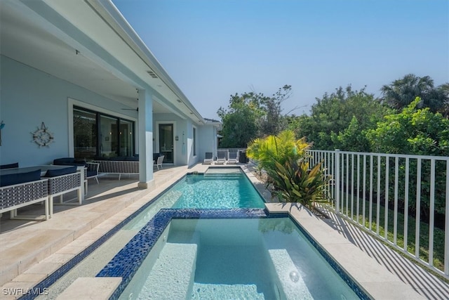 view of pool with an in ground hot tub, a patio, and ceiling fan