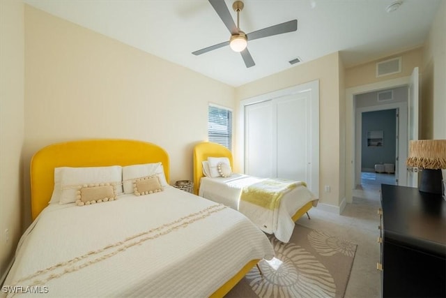 bedroom featuring carpet, a closet, and ceiling fan