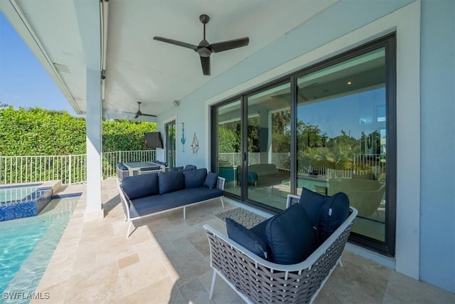 view of patio / terrace with ceiling fan and a pool with hot tub