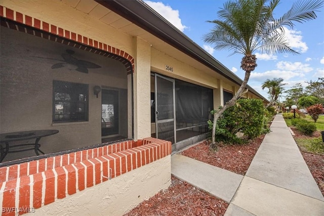 view of exterior entry with stucco siding