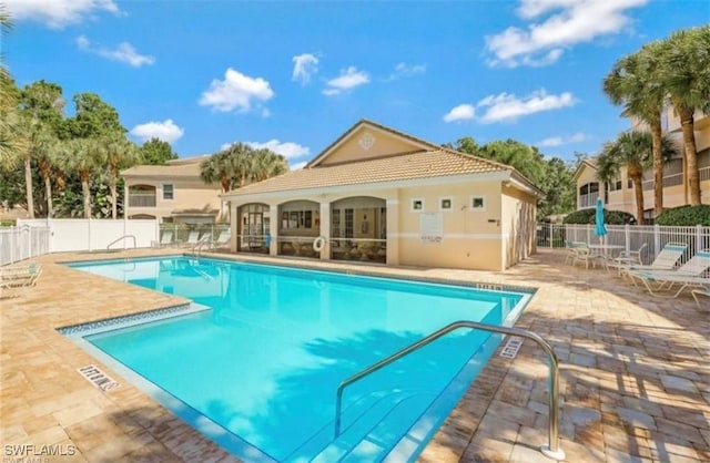 view of swimming pool with a patio