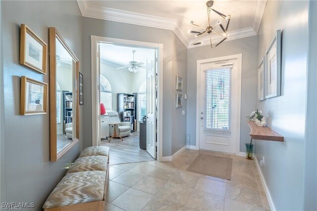 entryway featuring ceiling fan with notable chandelier, light tile patterned floors, and crown molding