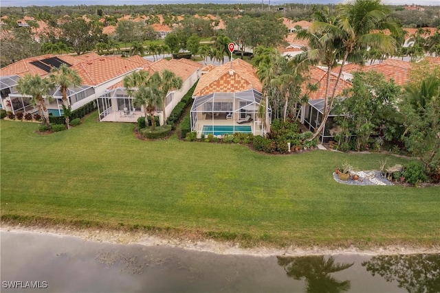 birds eye view of property with a water view