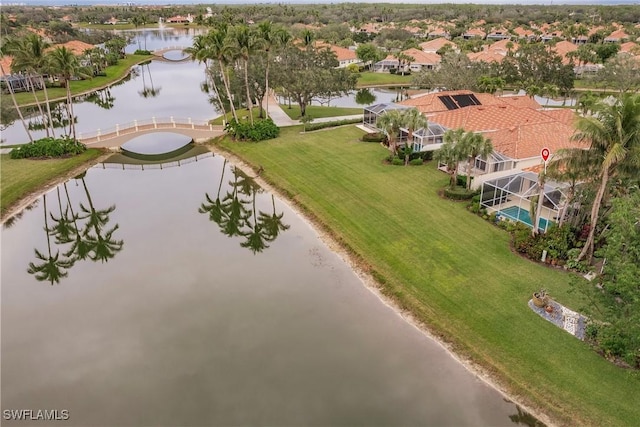 drone / aerial view with a water view