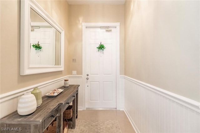 doorway to outside featuring light tile patterned floors