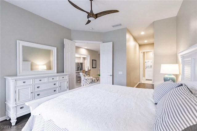 bedroom featuring connected bathroom, ceiling fan, and dark hardwood / wood-style floors