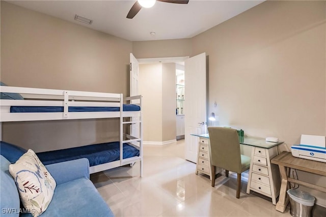 bedroom with ceiling fan and light tile patterned flooring