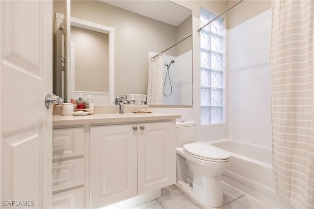 full bathroom with tile patterned floors, vanity, a healthy amount of sunlight, and shower / tub combo