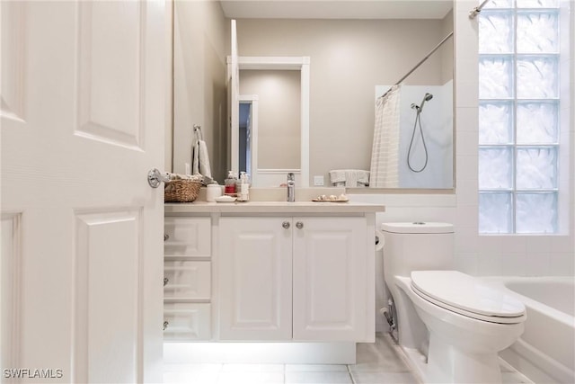 bathroom featuring tile patterned floors, vanity, and toilet