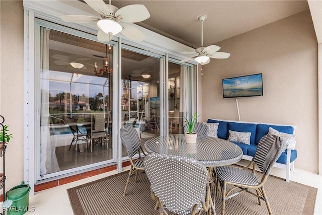 dining space featuring tile patterned floors and ceiling fan