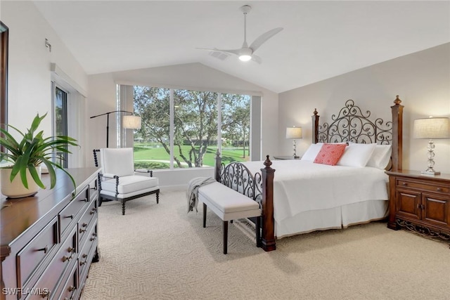 carpeted bedroom featuring lofted ceiling and ceiling fan