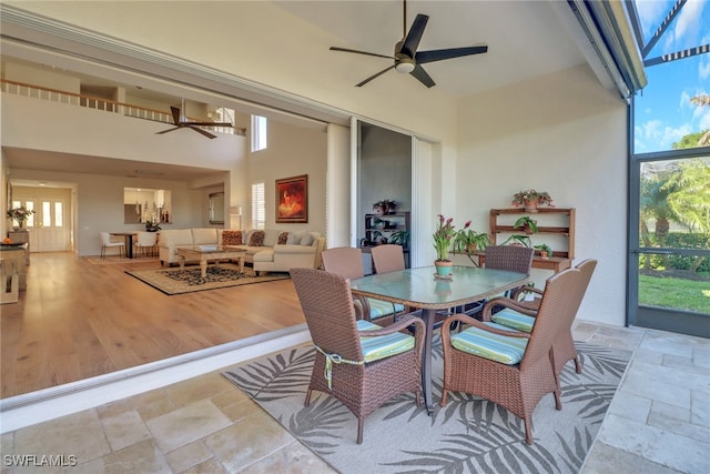 sunroom / solarium with ceiling fan