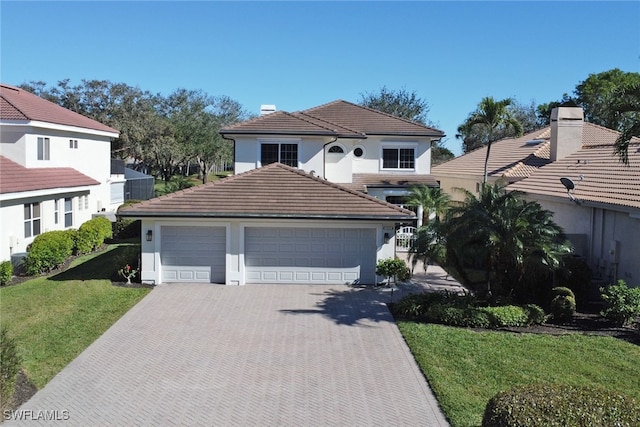 view of front of property with a garage and a front yard