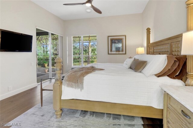 bedroom with ceiling fan, access to exterior, and dark hardwood / wood-style flooring