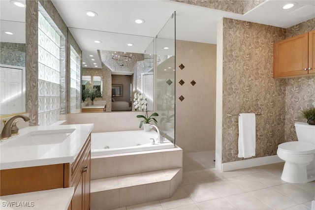 full bathroom with toilet, tile patterned floors, shower with separate bathtub, and vanity