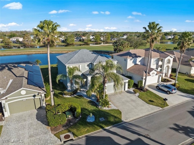 birds eye view of property featuring a water view