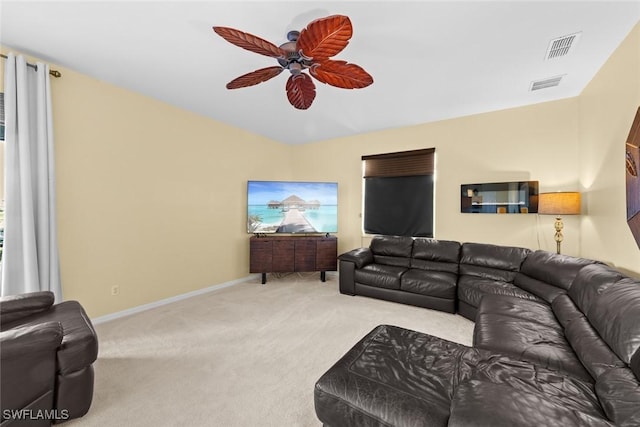 living room featuring light carpet and ceiling fan