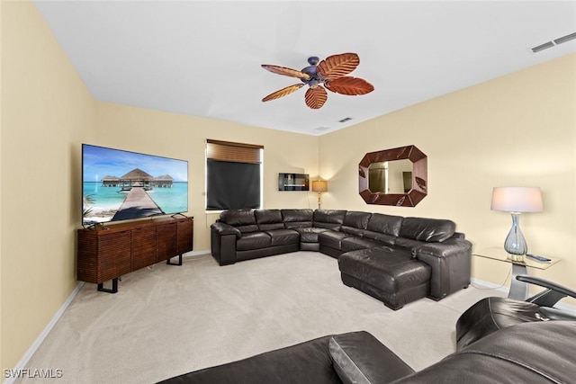 carpeted living room featuring ceiling fan