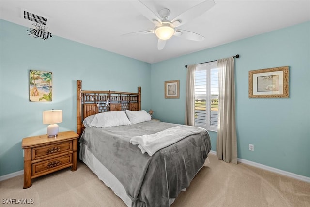 bedroom with light colored carpet and ceiling fan