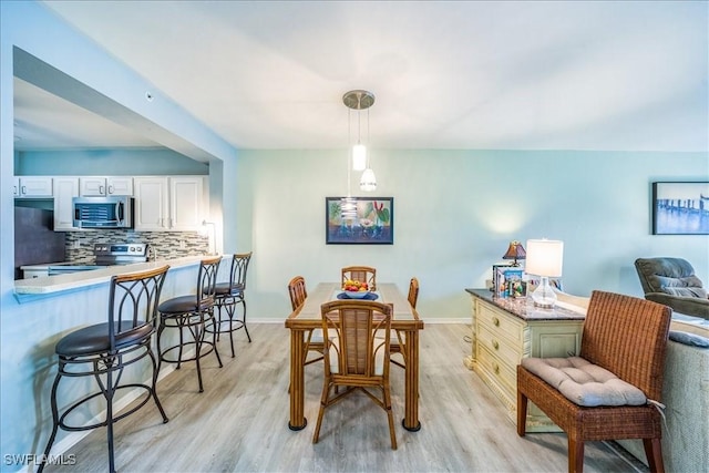 dining room featuring light wood-type flooring