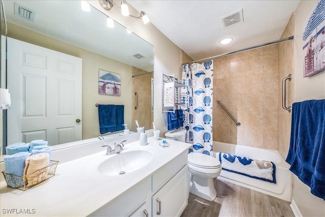 bathroom with vanity, hardwood / wood-style flooring, and toilet