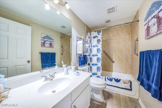 full bathroom with toilet, hardwood / wood-style floors, vanity, and shower / tub combo with curtain