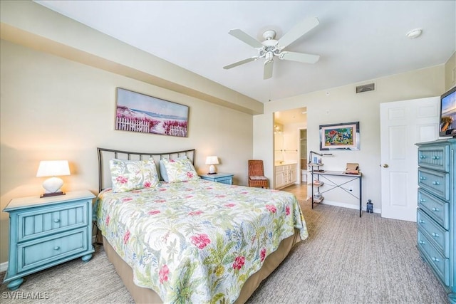 bedroom with ceiling fan and ensuite bath