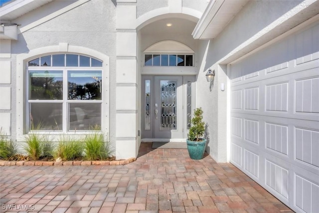 property entrance with a garage