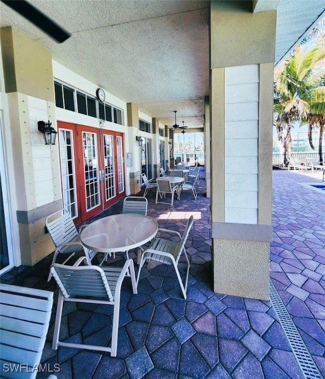 view of patio / terrace with french doors and ceiling fan