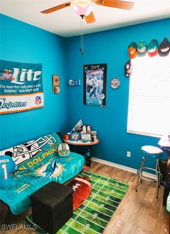 bedroom featuring ceiling fan and hardwood / wood-style floors