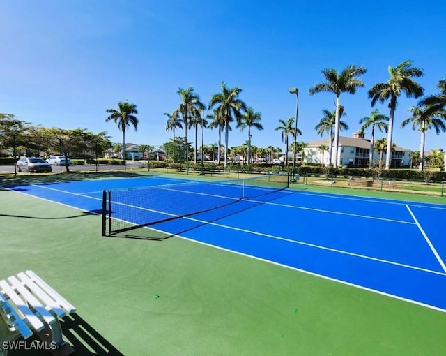 view of tennis court featuring basketball court