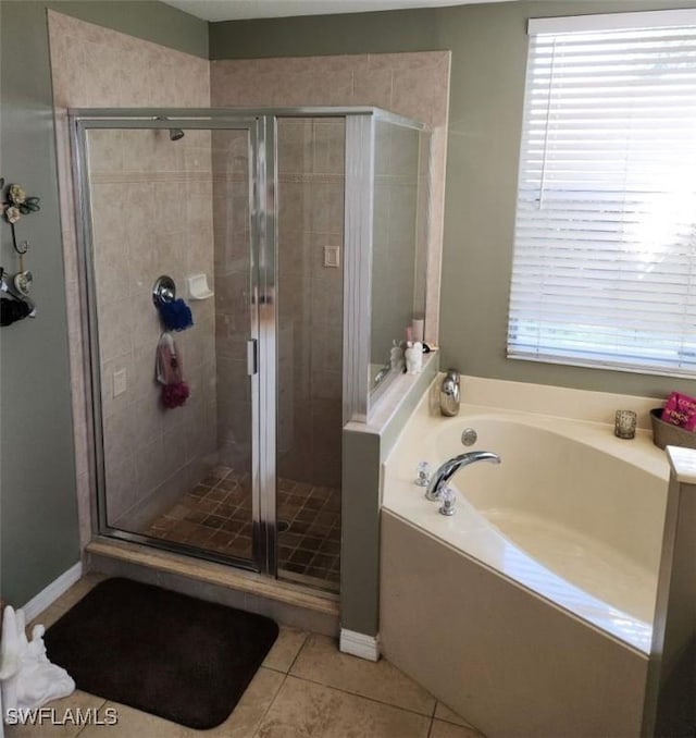 bathroom with tile patterned flooring and plus walk in shower