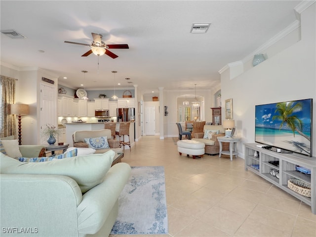 13538 Troia Dr, Estero, FL 33928 - living area with crown molding, ceiling fan with notable chandelier, light tile patterned floors, and visible vents