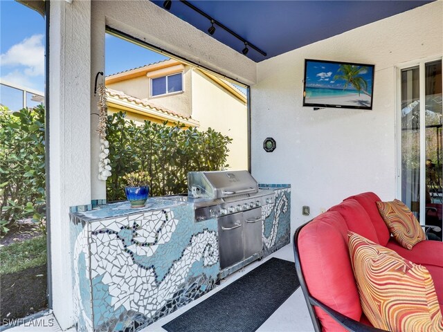 view of patio featuring an outdoor kitchen