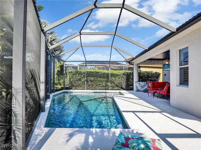 view of swimming pool with a patio area and glass enclosure