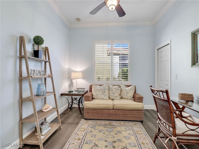 home office with ornamental molding, ceiling fan, and hardwood / wood-style flooring