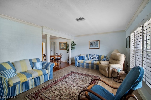 tiled living room featuring a textured ceiling and crown molding