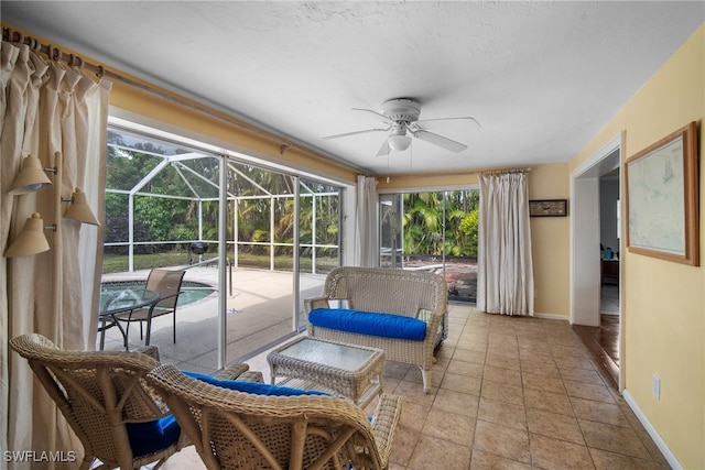 sunroom featuring a pool