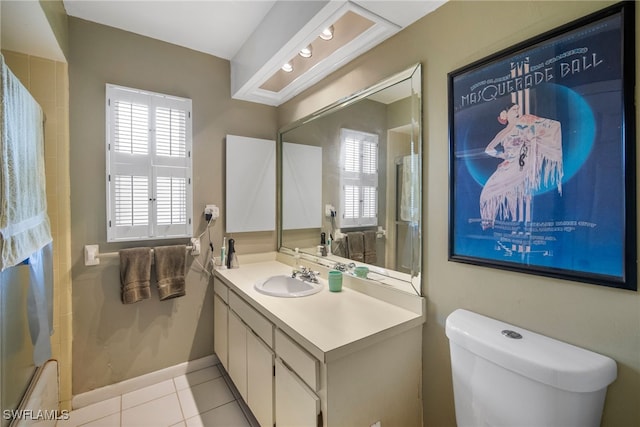 bathroom with tile patterned floors, vanity, and toilet