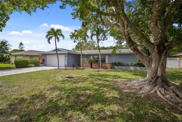 single story home with a front lawn and a garage