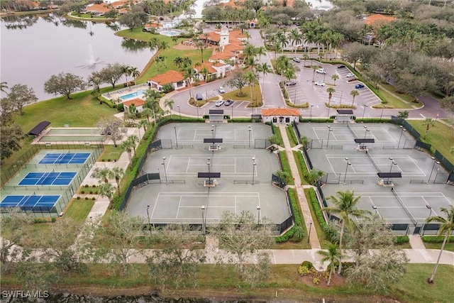 birds eye view of property with a water view