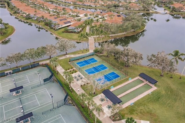 birds eye view of property featuring a water view