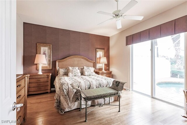 bedroom with ceiling fan, access to outside, and light hardwood / wood-style floors