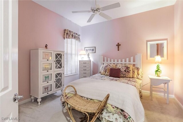 bedroom with ceiling fan and light carpet