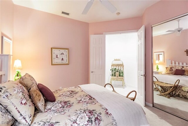 bedroom featuring light colored carpet and ceiling fan