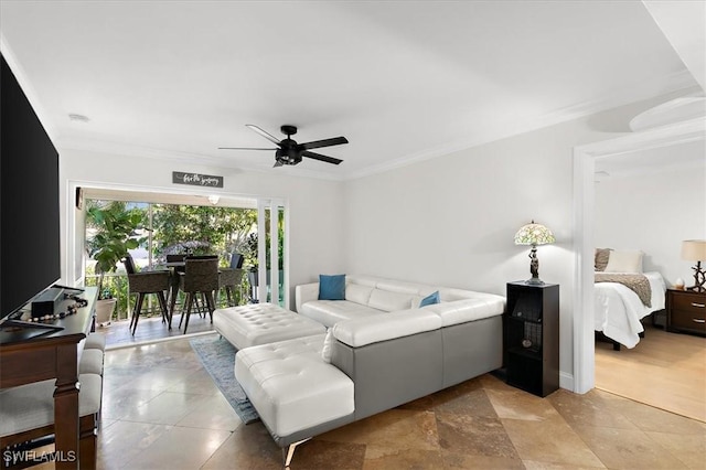 living room featuring ceiling fan and ornamental molding