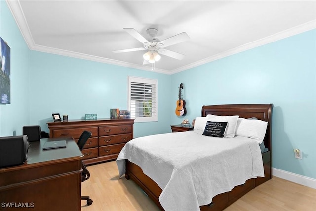 bedroom featuring ceiling fan, crown molding, and light hardwood / wood-style flooring