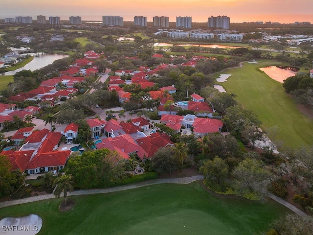 aerial view at dusk with a water view