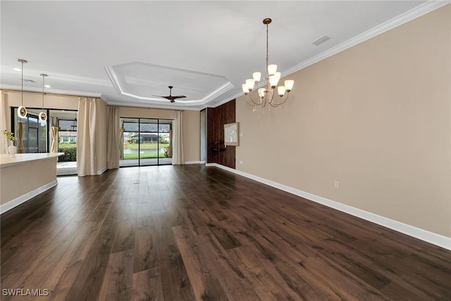 interior space with a tray ceiling, crown molding, dark hardwood / wood-style flooring, and ceiling fan with notable chandelier