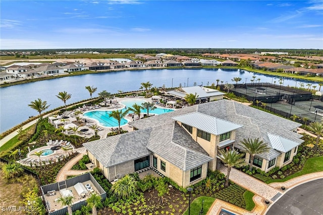 birds eye view of property featuring a water view